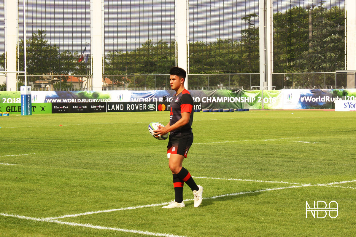England sensation Marcus Smith warming up before coming off the bench to score a try / Joe Ruzvidzo